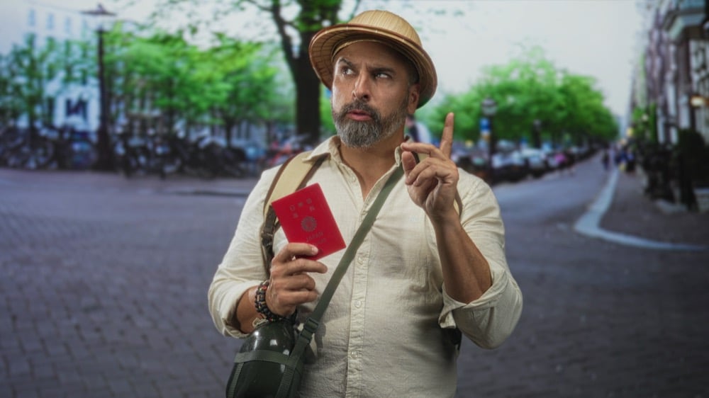 A bearded traveller showing questioning face