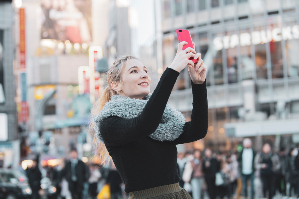 Foreign tourists using WiFi and smartphones in Japan