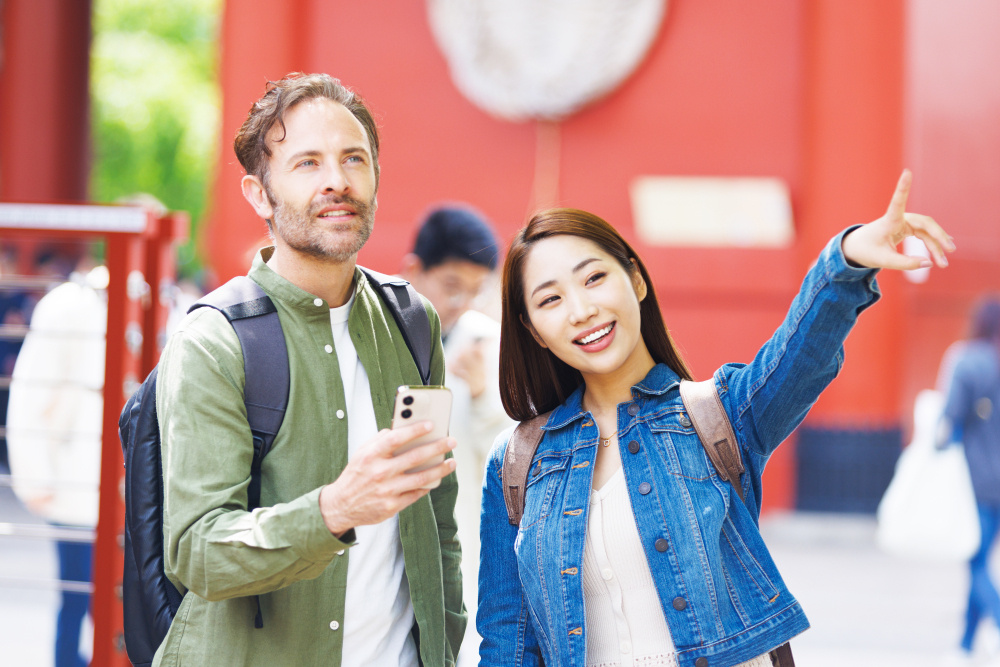 Tourists using their phones to find places to visit