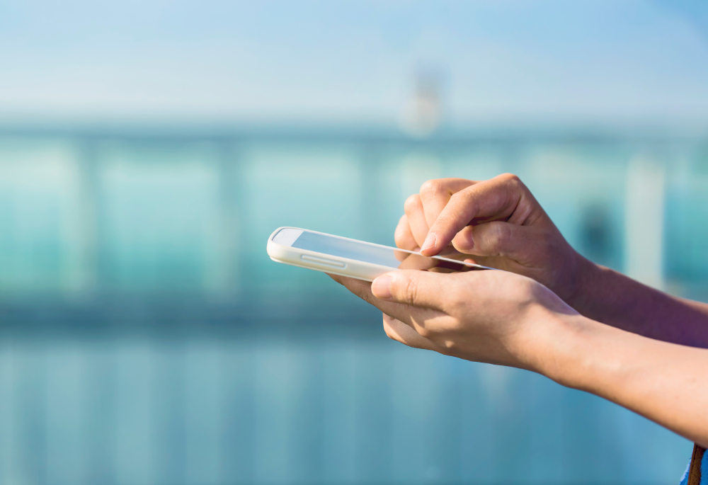 A foreigner using a smartphone in Japan