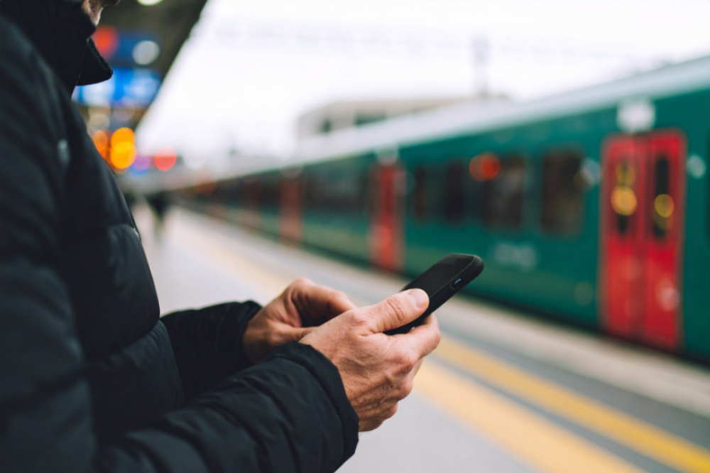 A person searching on their smartphone for how to rent a pocket Wi-Fi in Tokyo