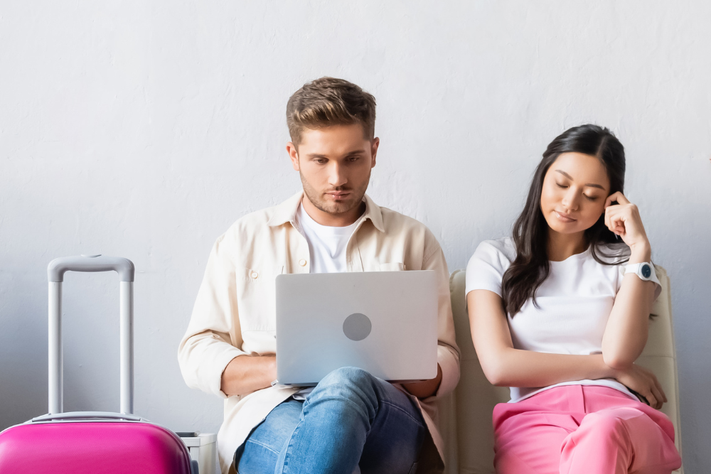 A man and a woman are considering which WiFi rental to choose