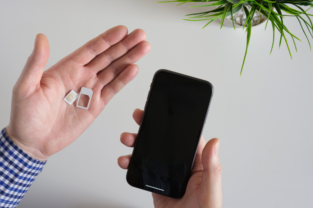A SIM card and a smartphone
