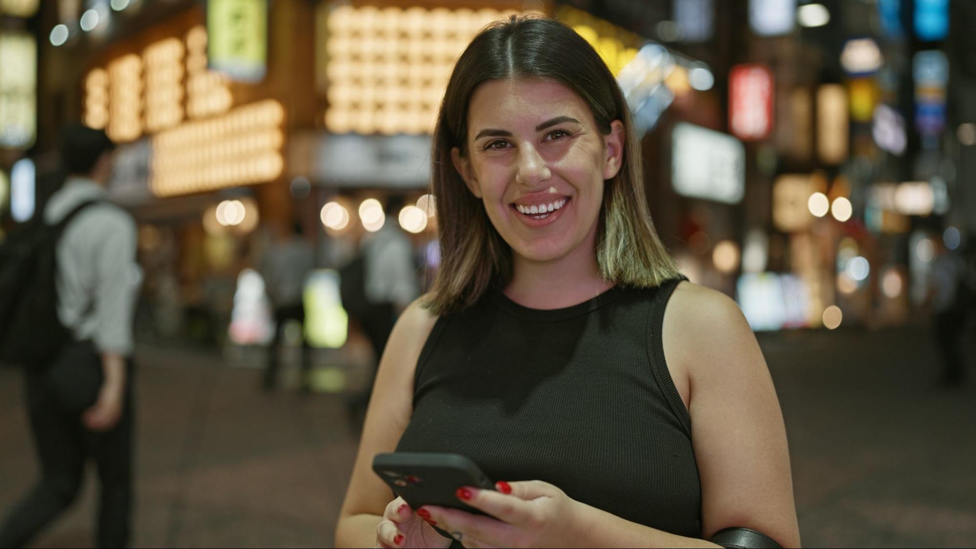 A foreign woman happy after choosing the best eSIM plan