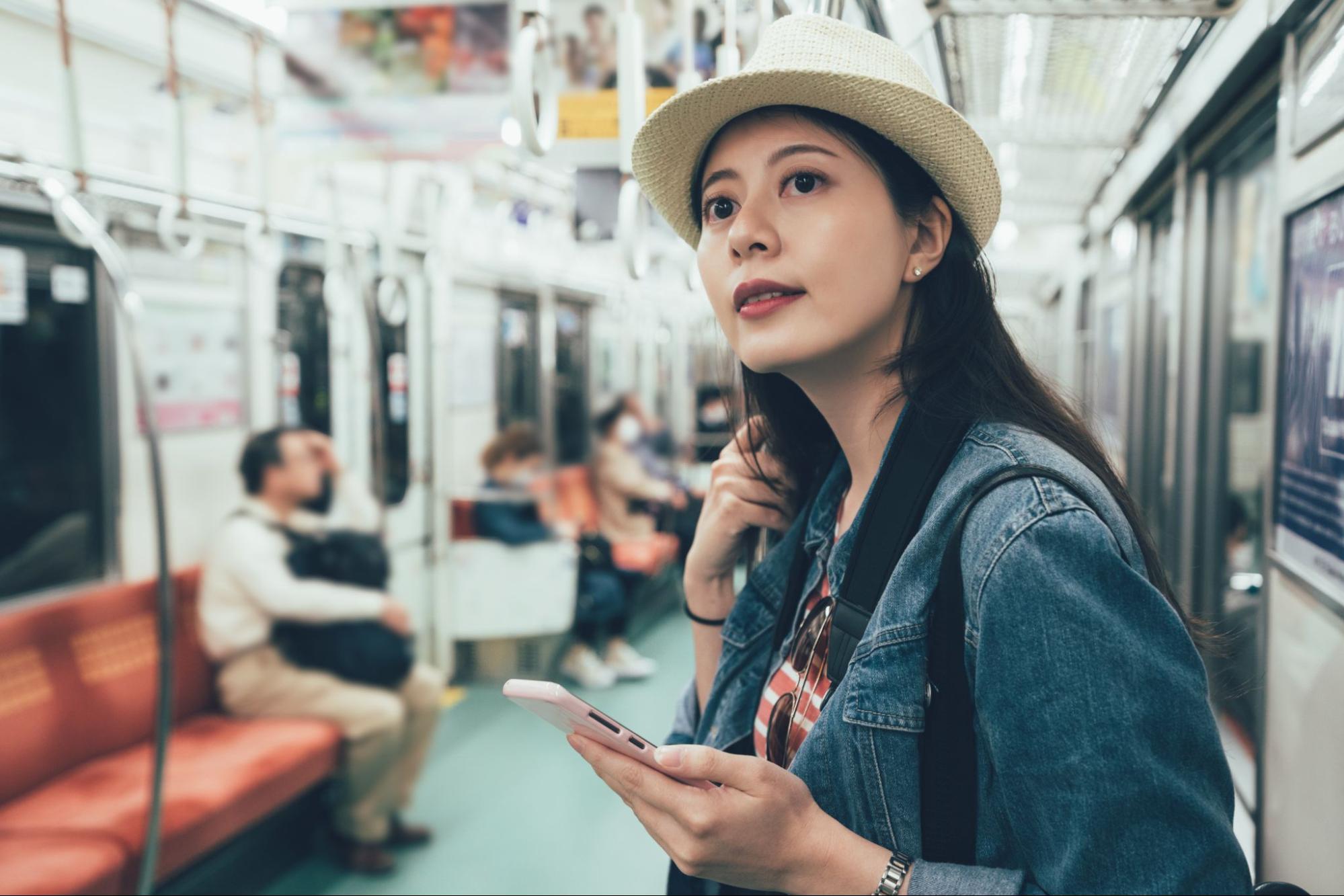 Browsing on a smartphone while riding a train with rented Wi-Fi