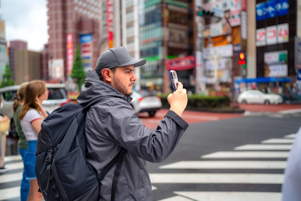 Foreign tourists using a smartphone in Japan