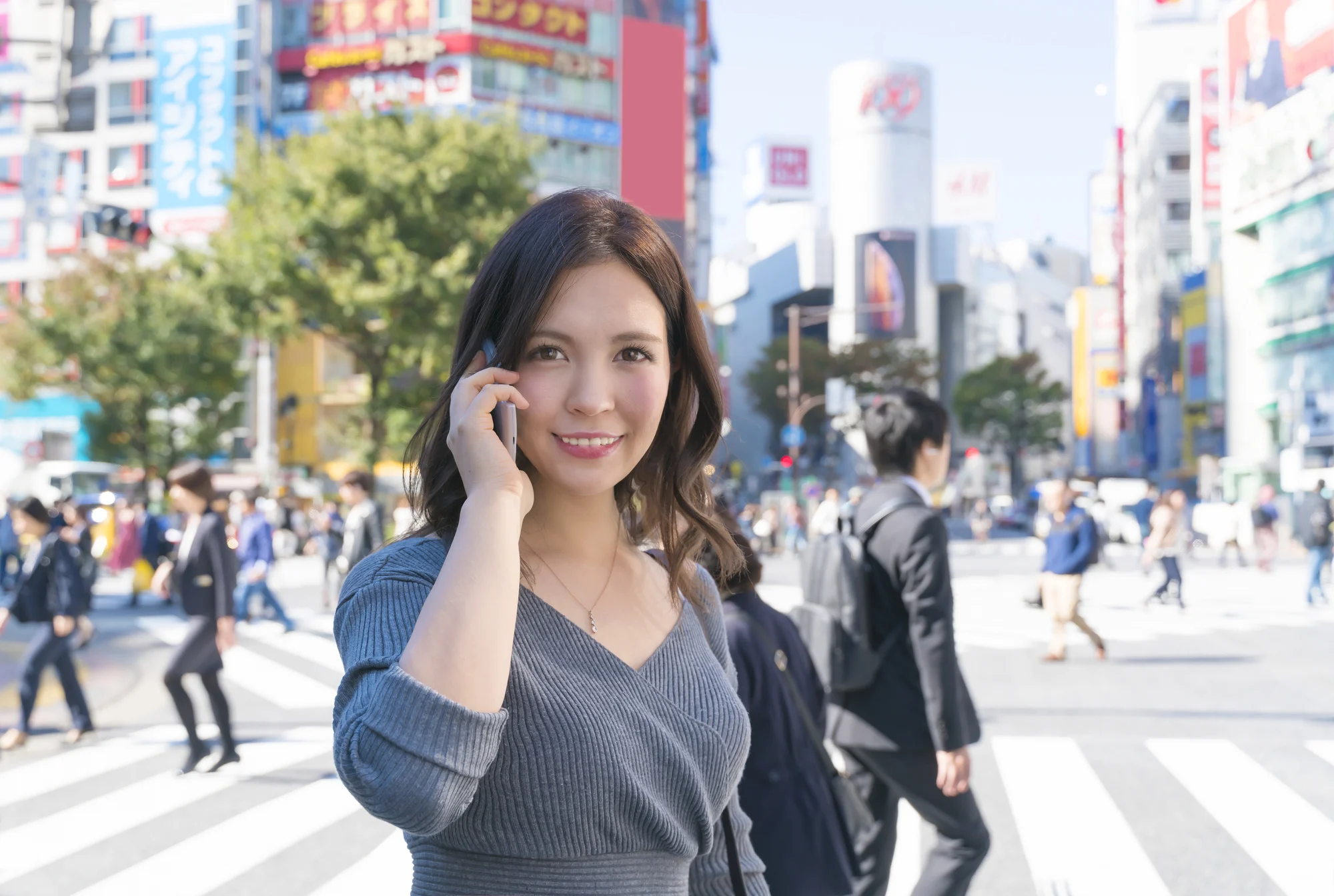 Woman using smartphones when traveling to Japan